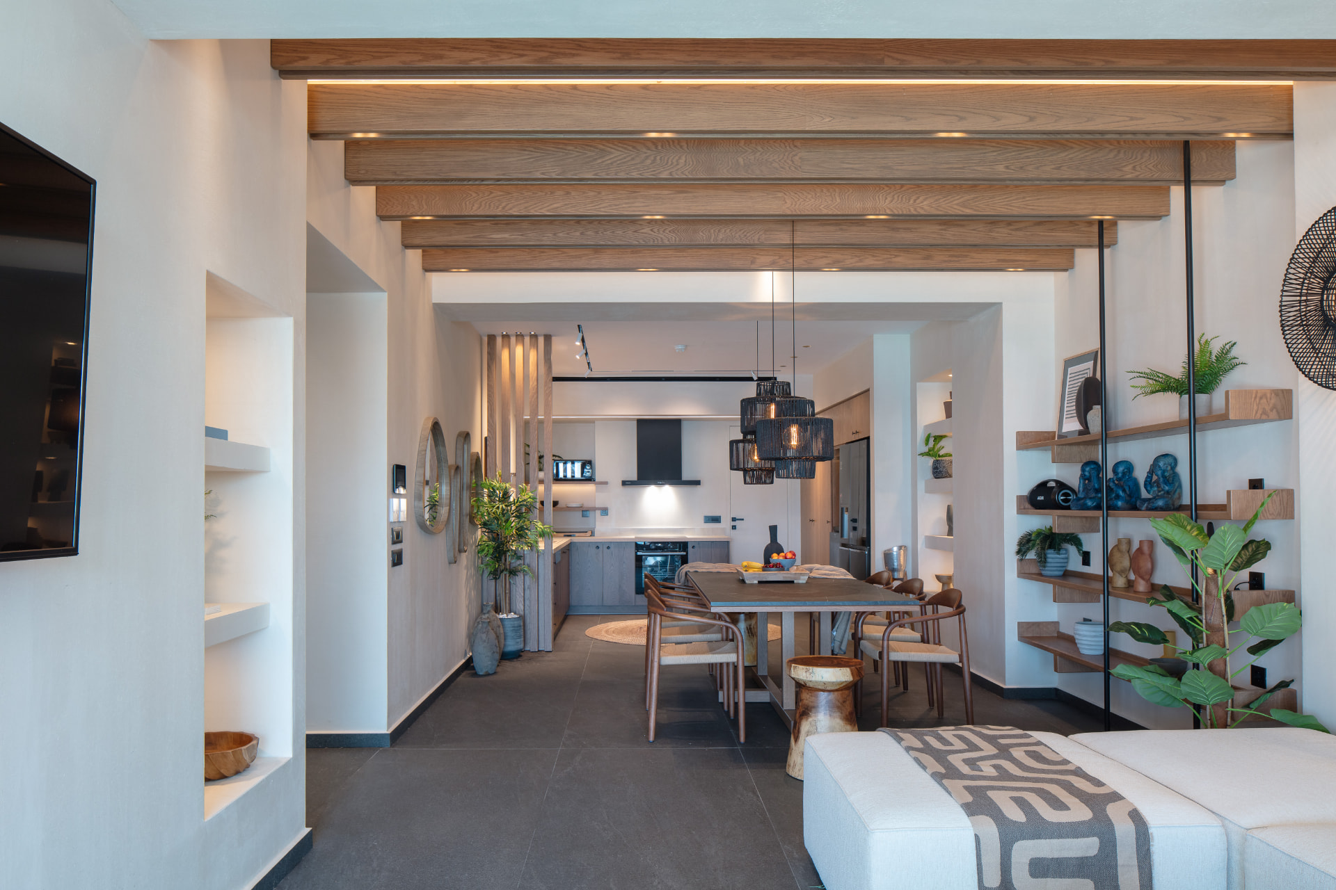 Open-plan living and kitchen with oak beams and natural light