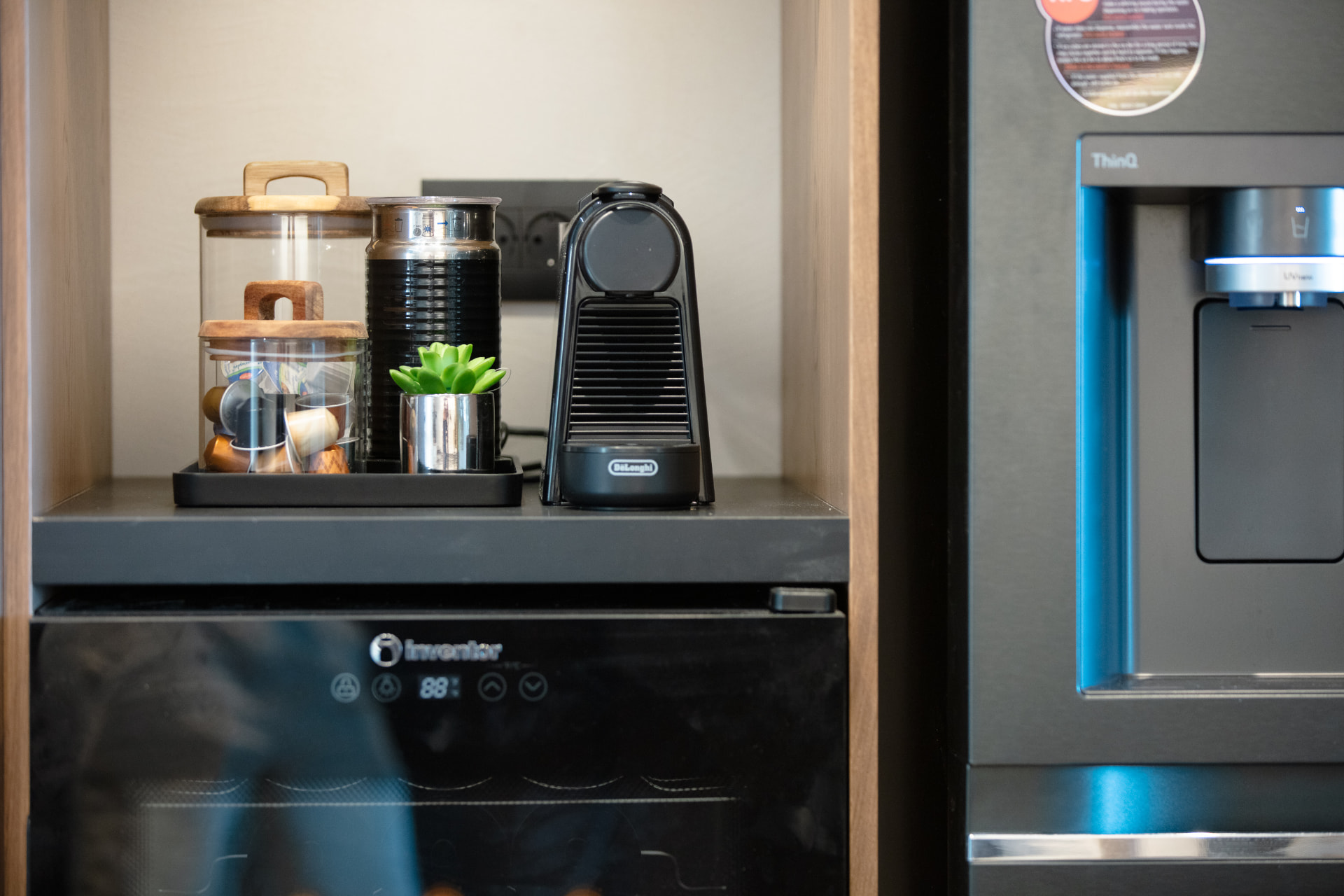Nespresso machine, wine cooler and fridge detail