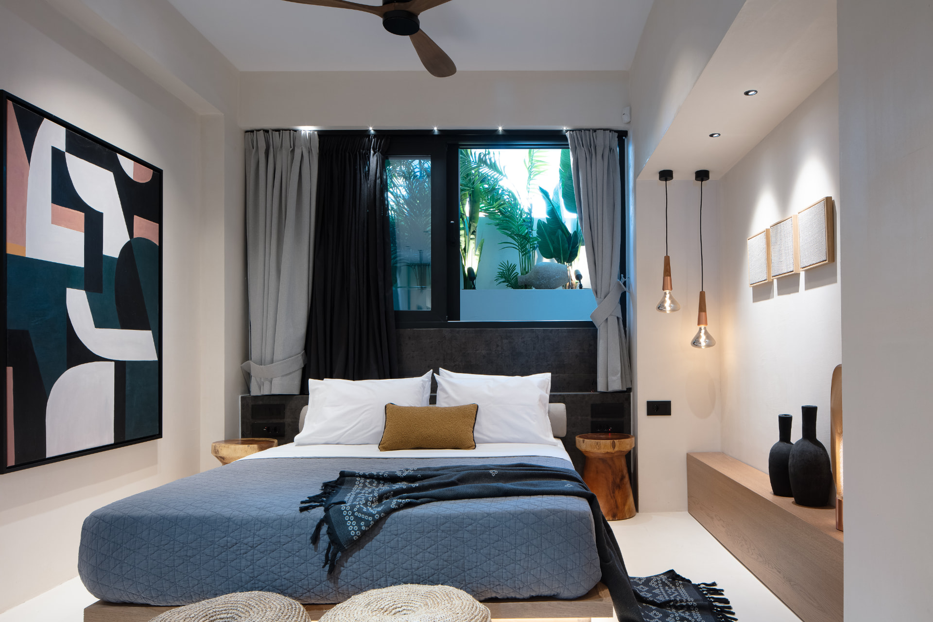 Bedroom three with queen bed, mustard cushion and tropical window view