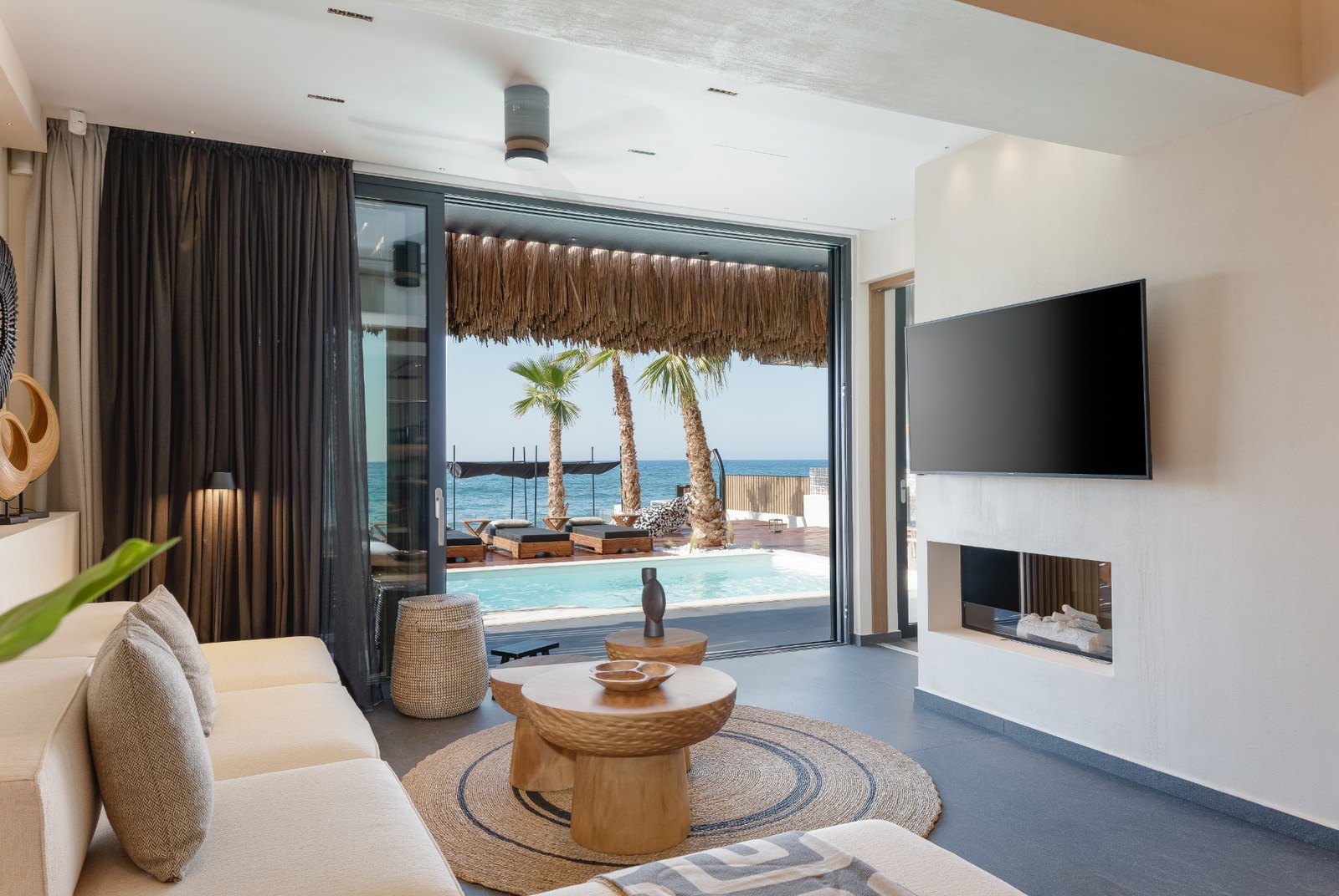 Living area of Casa Negro open to the sea